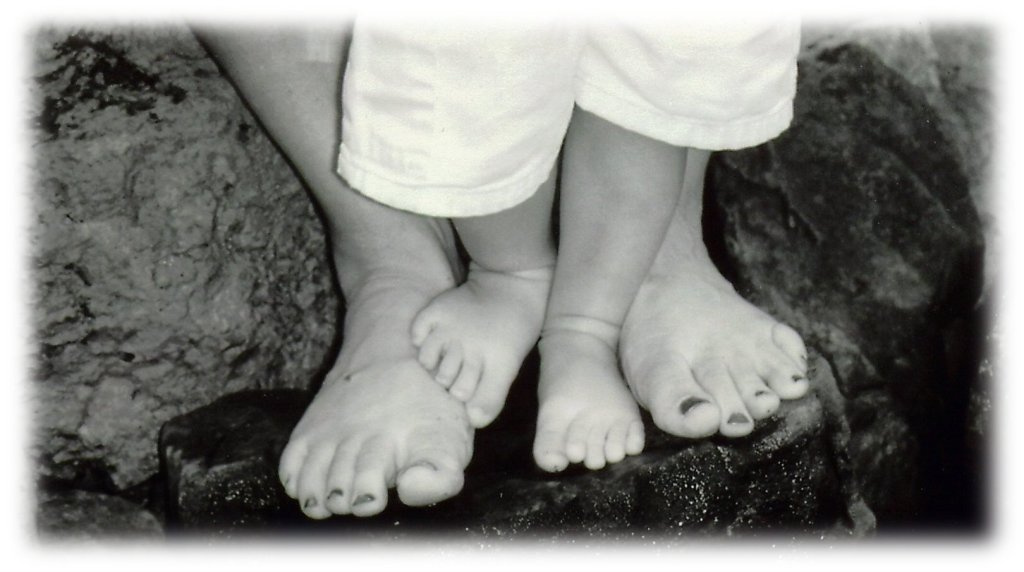 This image has an empty alt attribute; its file name is brochure-mom-son-feet-blur.jpg