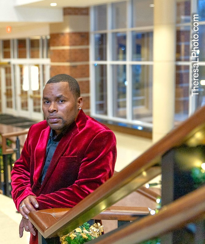 black man on staircase at Lindenwood University Scheidigger Center staircase.